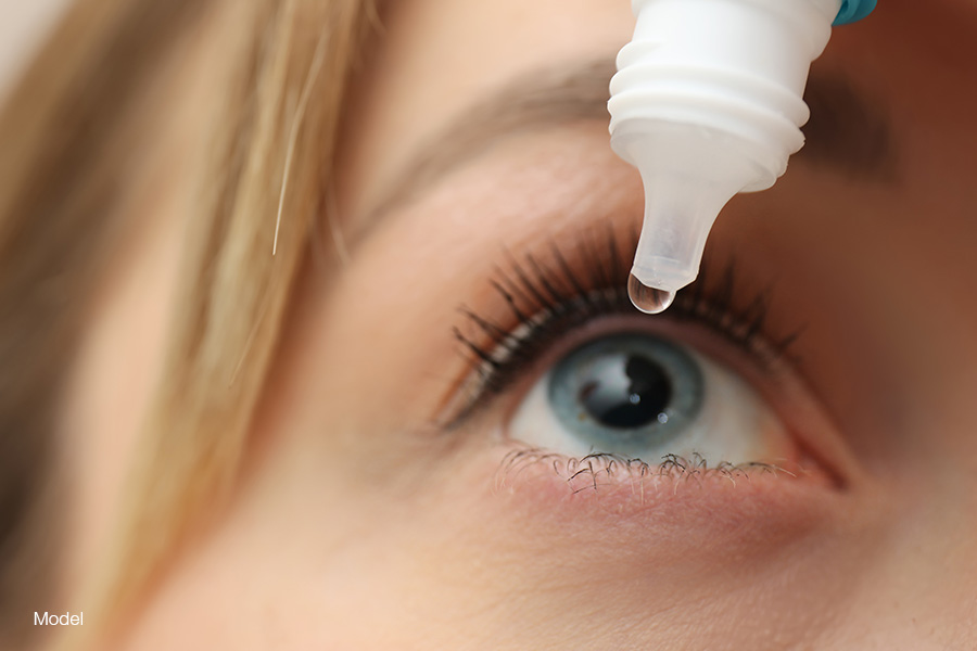 Woman putting a drop in her eye