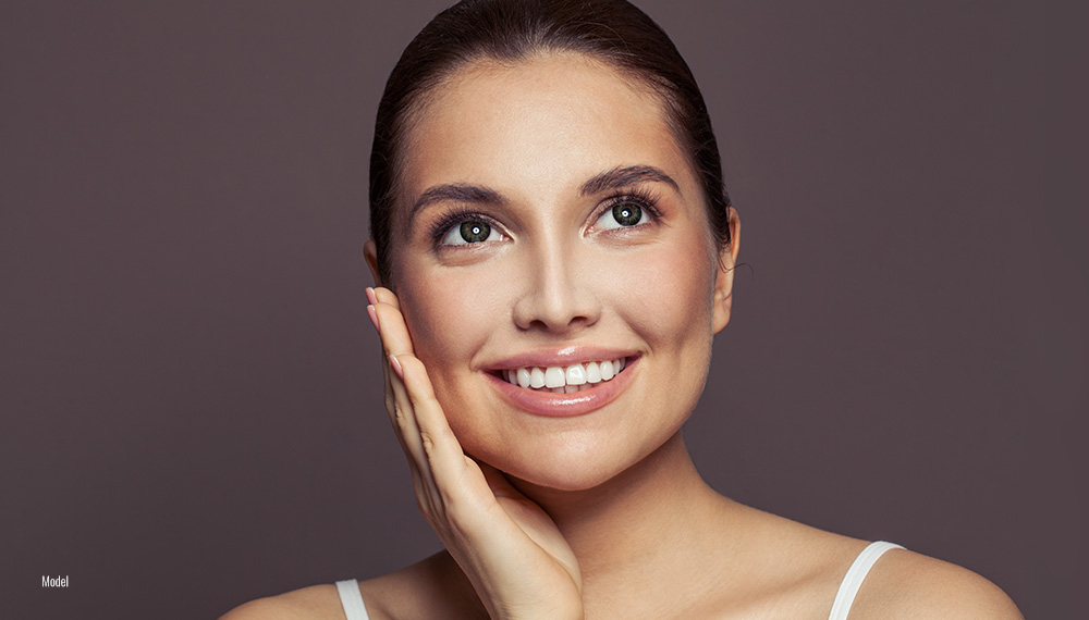 Beautiful women enjoying her skin after the facial